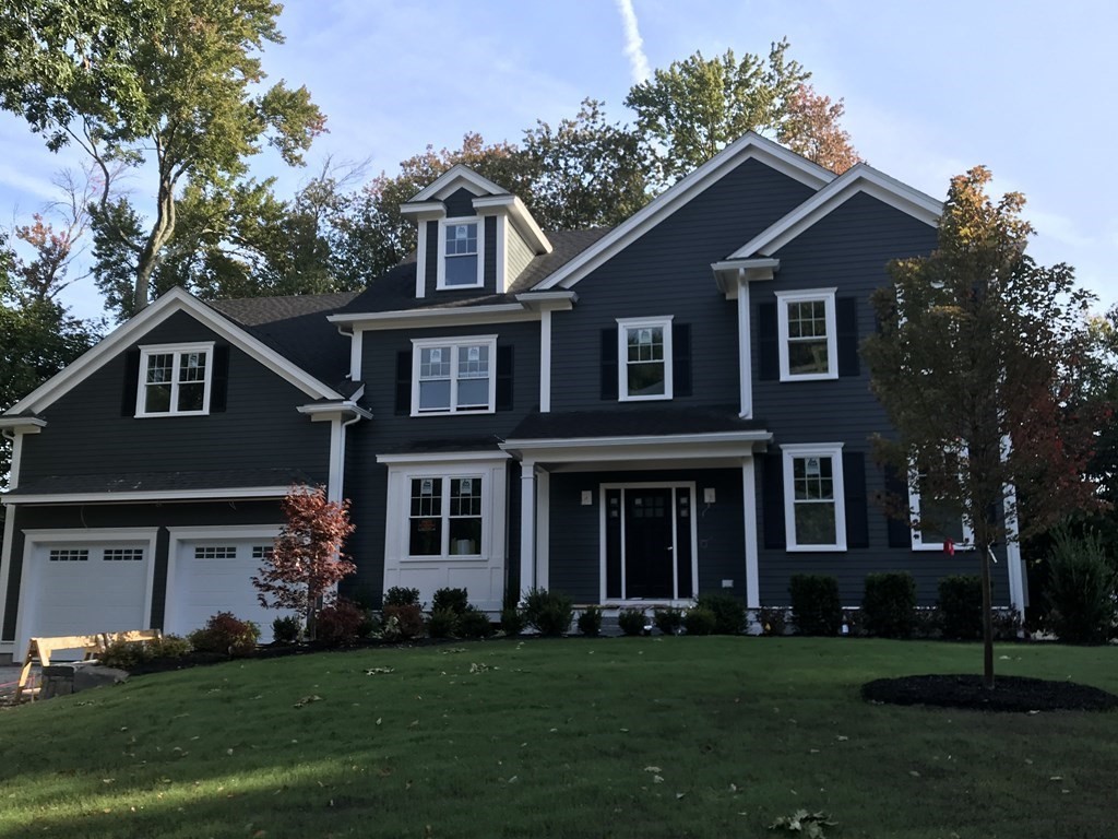 16 Jonathan Lane Bedford, MA 01730 - Photo 2 of 42 front view of a house with a yard