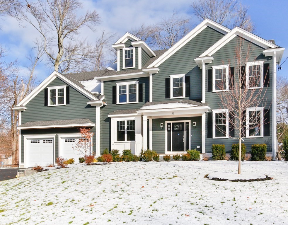 16 Jonathan Lane Bedford, MA 01730 - Photo 3 of 42 a front view of a house with a yard