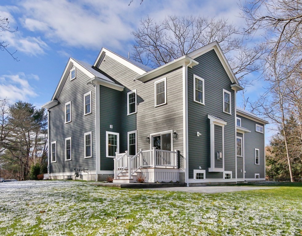 16 Jonathan Lane Bedford, MA 01730 - Photo 36 of 42 a front view of house with yard