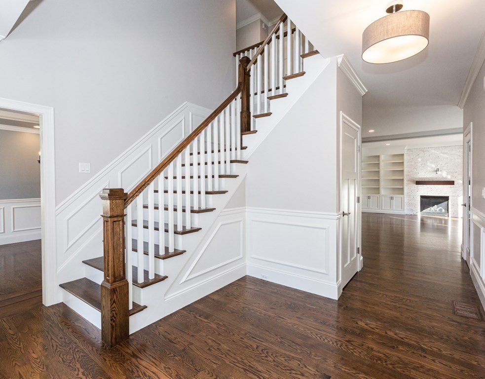 16 Jonathan Lane Bedford, MA 01730 - Photo 7 of 42 a view of entryway and hall with wooden floor