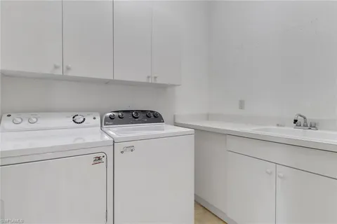 a bathroom with a toilet a sink and a mirror