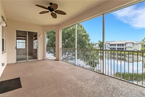 a view of a livingroom with a ceiling fan and window