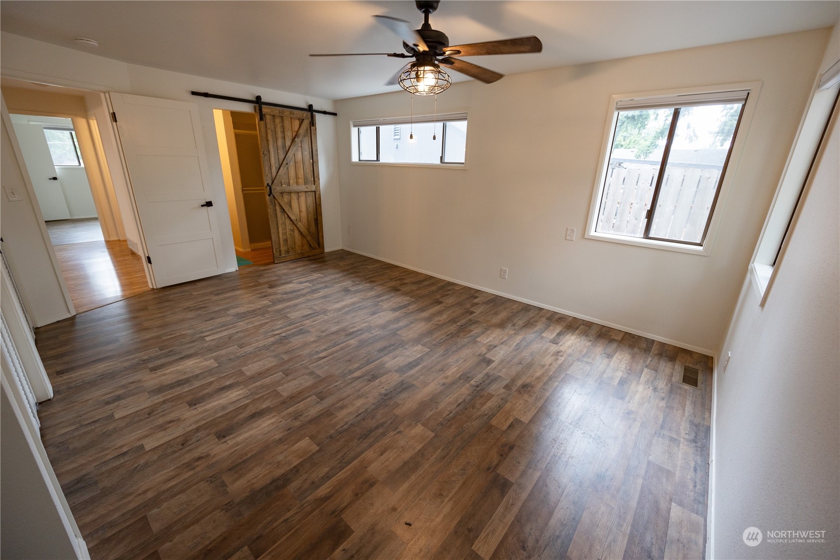 129 Del Monte Avenue Fircrest, WA 98466 - Photo 16 of 38 wooden floor in an empty room with a window