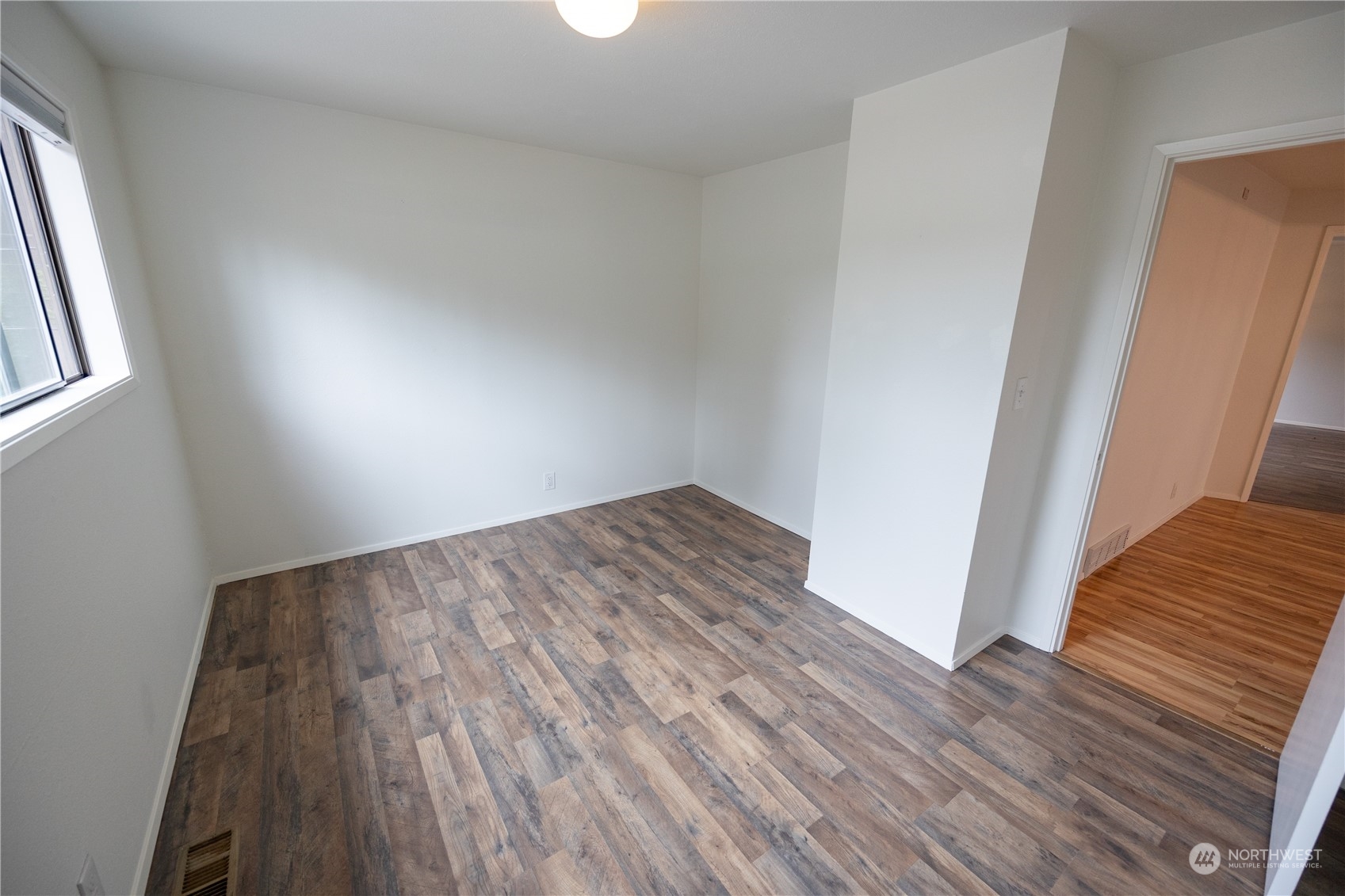 129 Del Monte Avenue Fircrest, WA 98466 - Photo 20 of 38 an empty room with wooden floor and closet