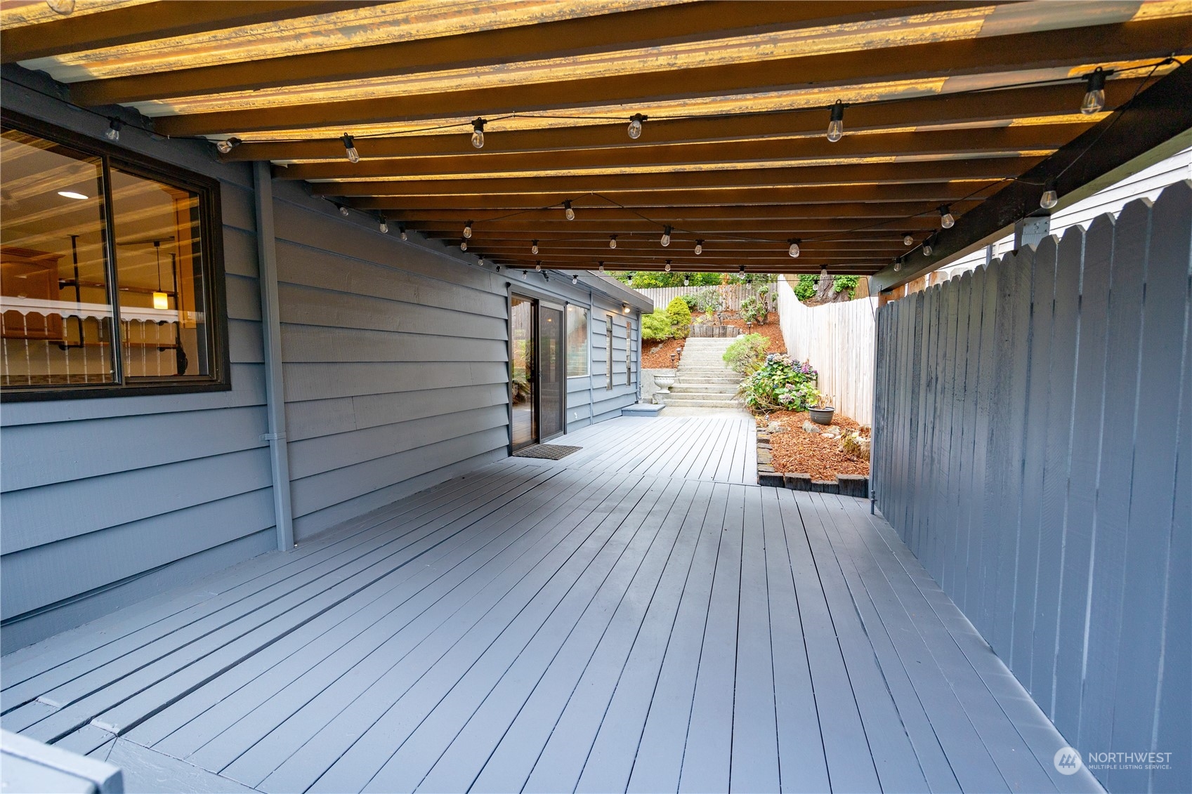 129 Del Monte Avenue Fircrest, WA 98466 - Photo 29 of 38 a view of deck with wooden floor and a ceiling fan