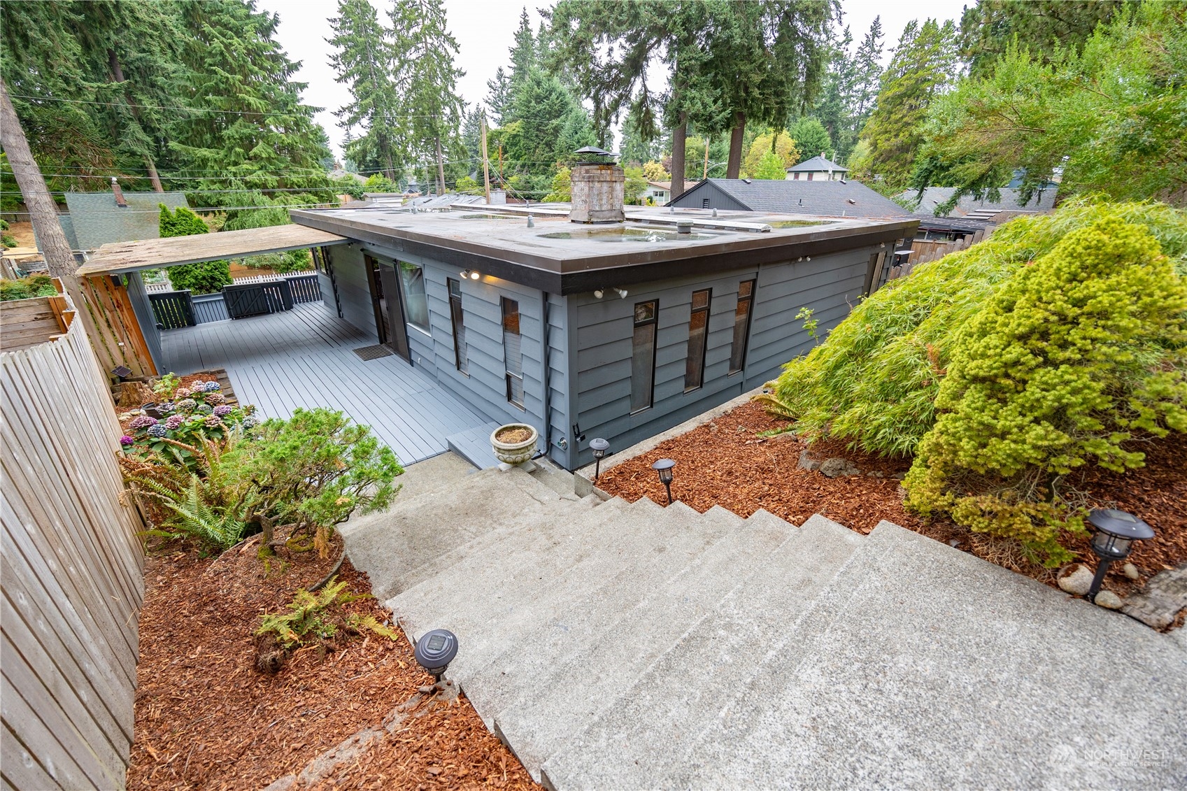 129 Del Monte Avenue Fircrest, WA 98466 - Photo 36 of 38 a view of a wooden deck and a backyard