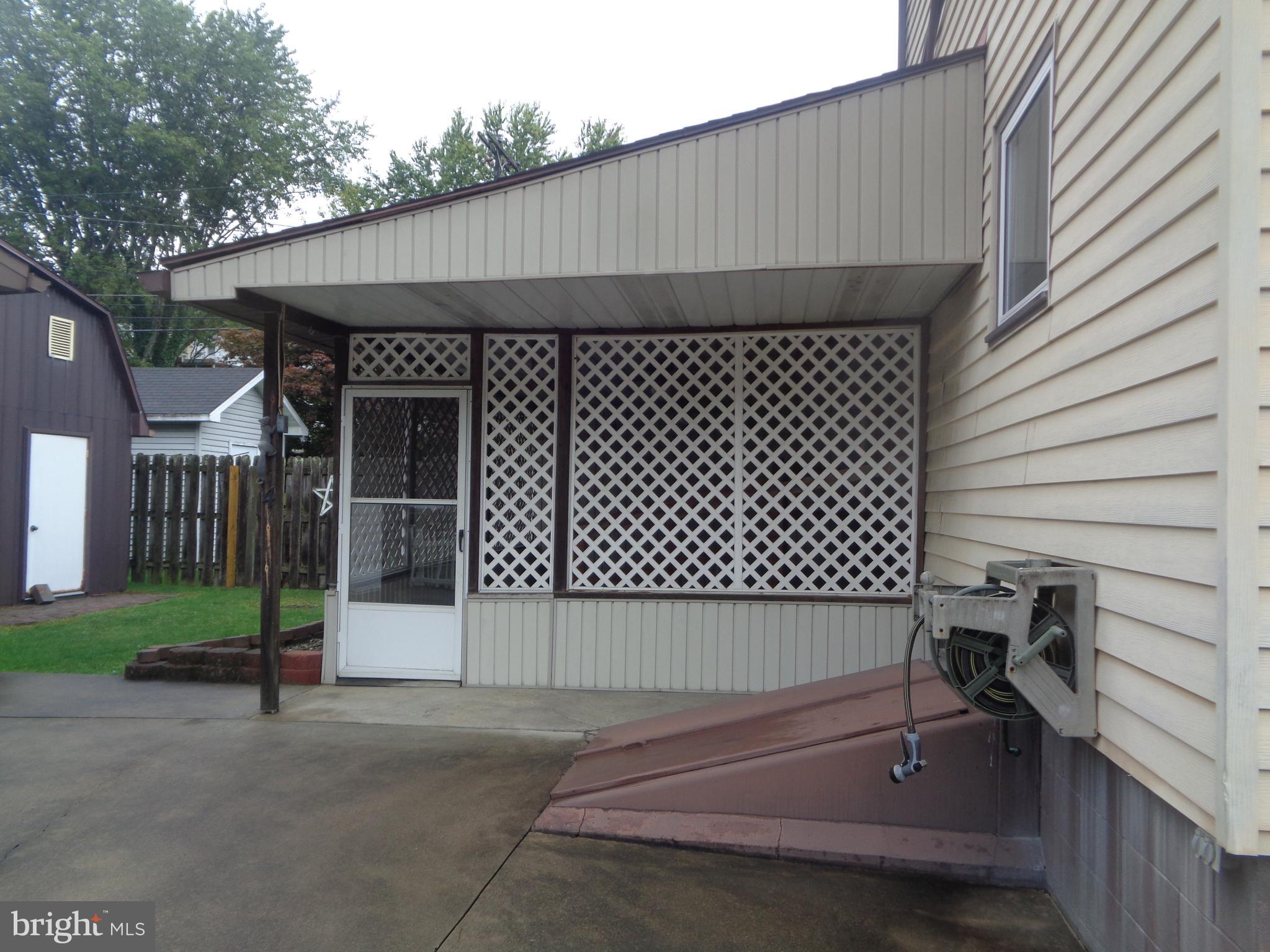 4 Waterfront Street Reedsville, PA 17084 - Photo 22 of 27 Rear screen porch and outside basement entrance