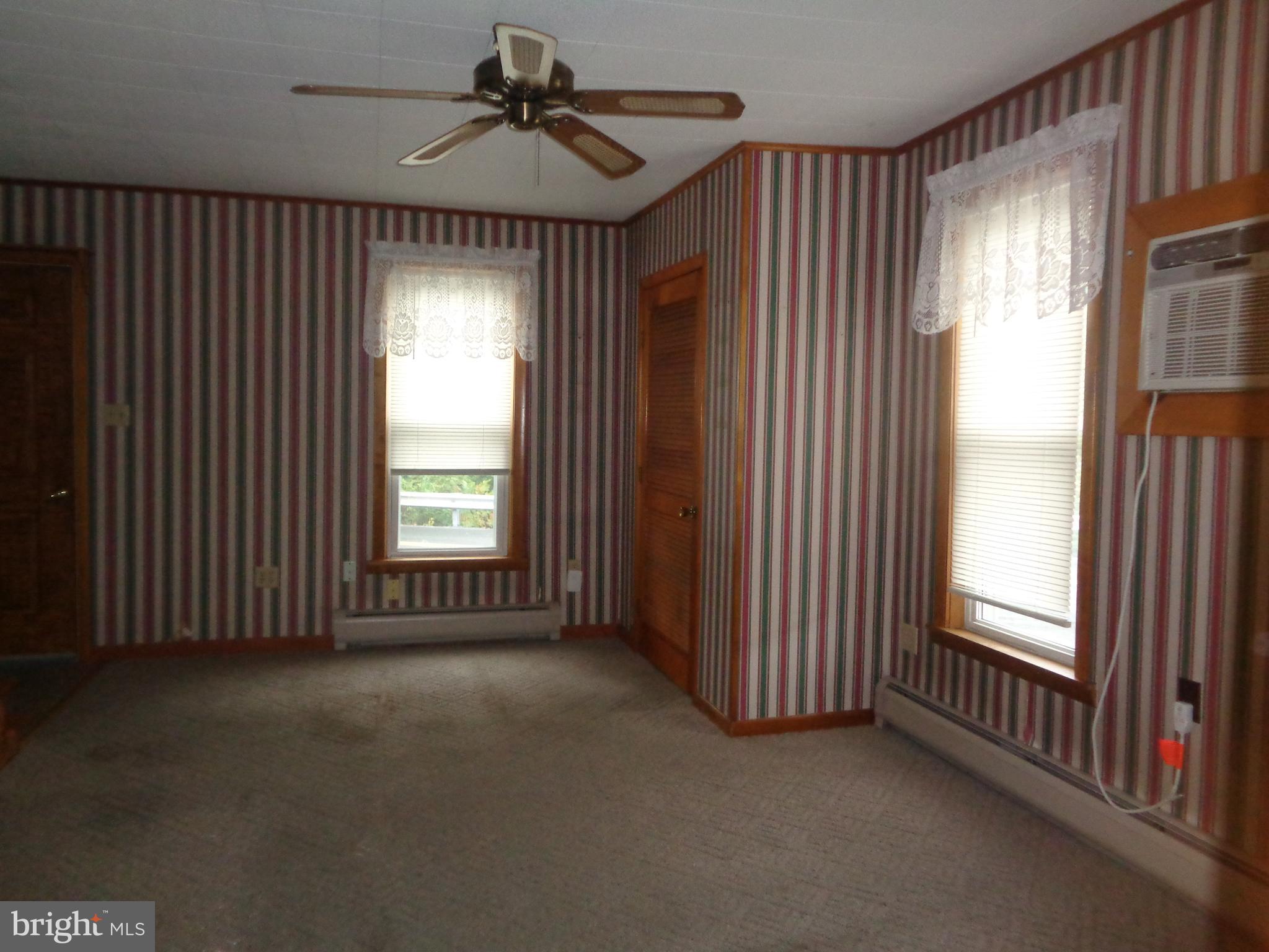 4 Waterfront Street Reedsville, PA 17084 - Photo 8 of 27 Living room with wall air conditioner