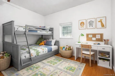 a bed room with furniture and a table