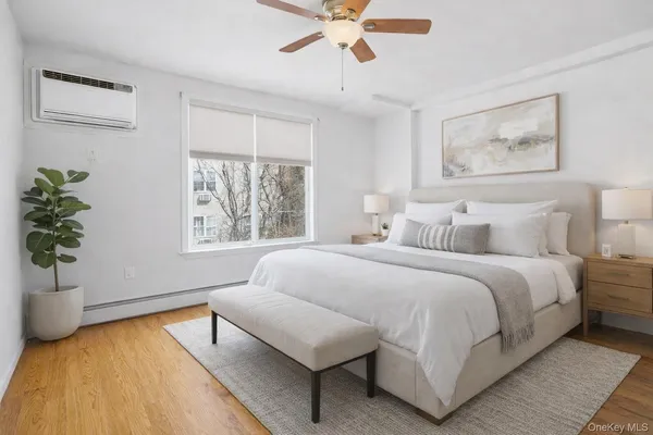 a bedroom with a large bed and a window