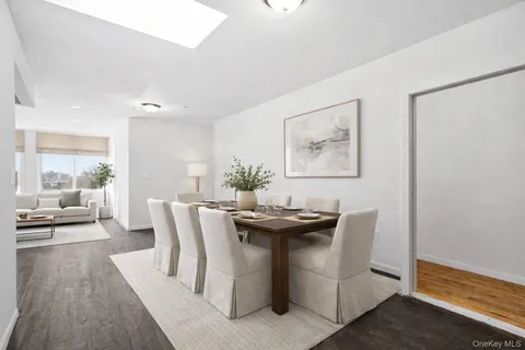 a dining room with furniture and wooden floor