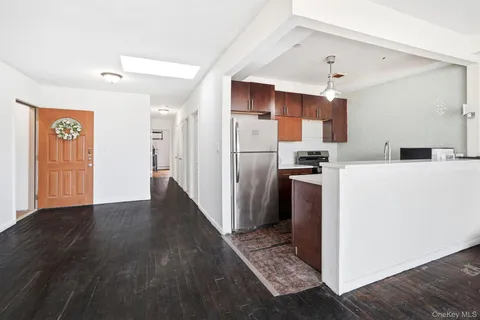 a kitchen with stainless steel appliances a refrigerator sink and cabinets