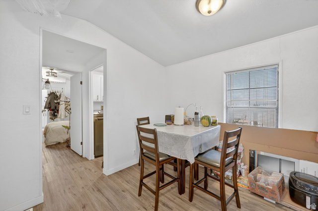 262 Hidden View Drive, Unit 94 Sandy, UT 84070 - Photo 13 of 18 Dining room featuring light wood finished floors and lofted ceiling