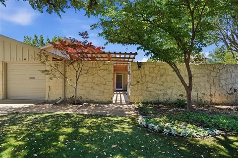 front view of a house with a small yard
