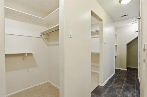 a view of hallway with walk in closet