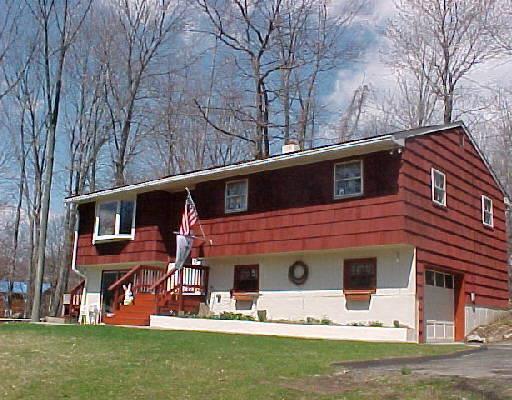 22 Rodline Road Danbury, CT 06811 - Photo 1 of 1 a front view of a house with a yard