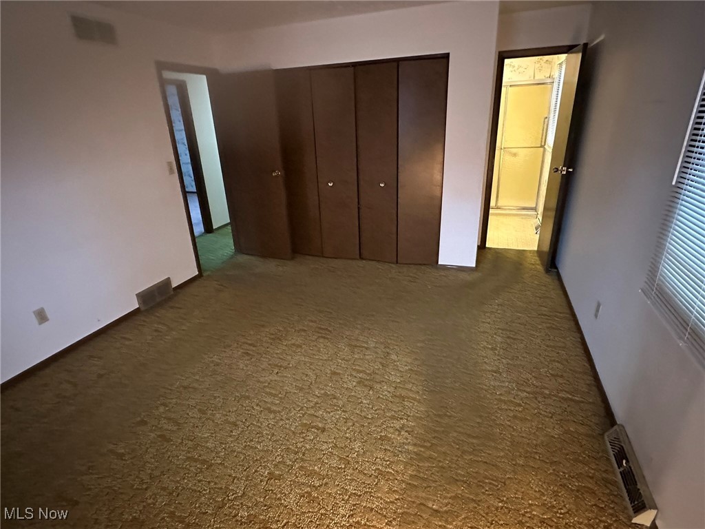 97 West Howe Road Tallmadge, OH 44278 - Photo 33 of 35 Unfurnished bedroom featuring a closet