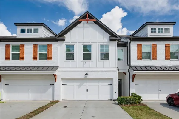 a front view of a house with a garage