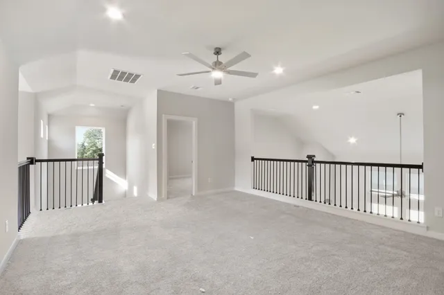 a bathroom with a granite countertop bathtub shower sink vanity and toilet