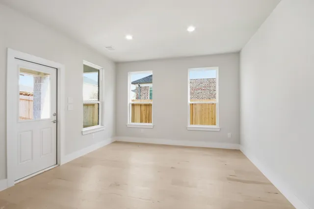 an empty room with windows