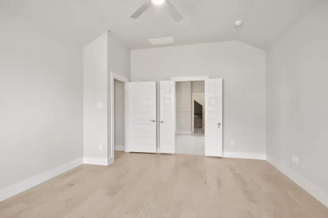 an empty room with closet area