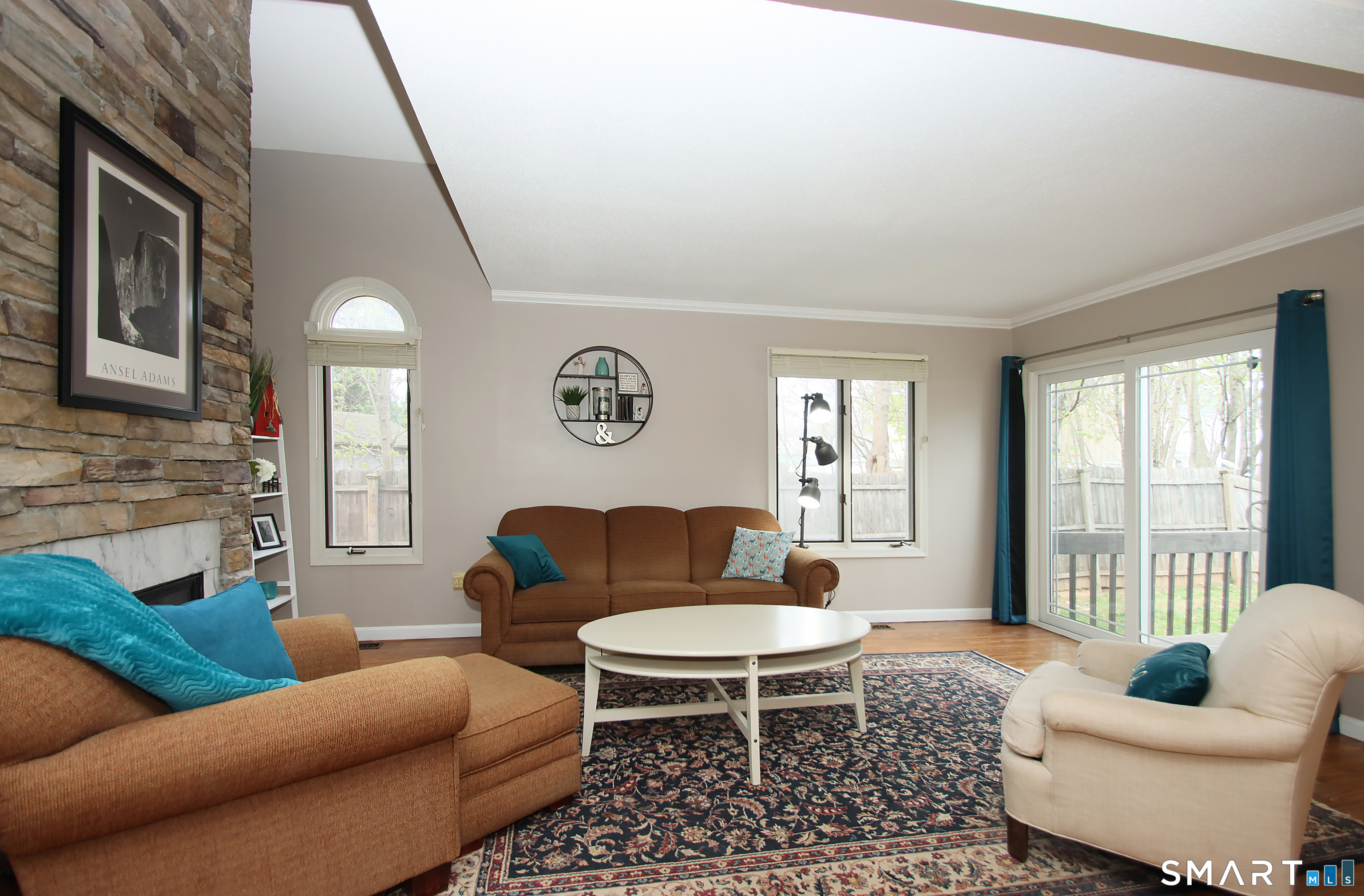 182 Main Street, Unit A Manchester, CT 06042 - Photo 13 of 34 Living Room with Gas Fireplace, Slider to deck.