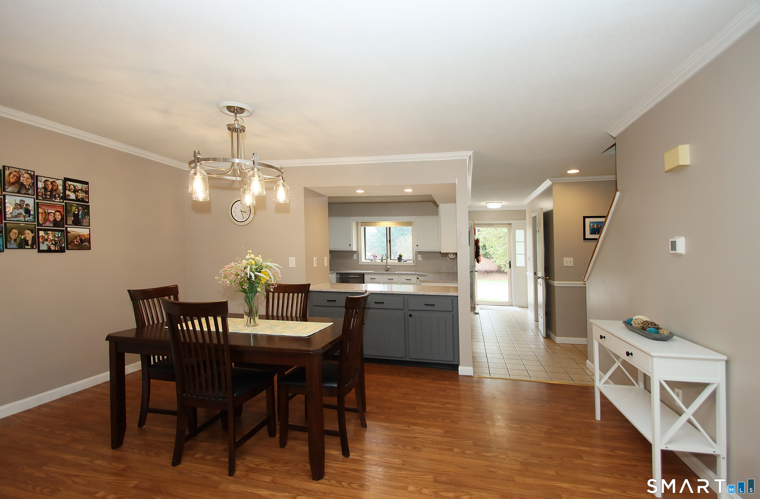 182 Main Street, Unit A Manchester, CT 06042 - Photo 18 of 34 View from Living Room to Dining, Kitchen, front hall and entrance