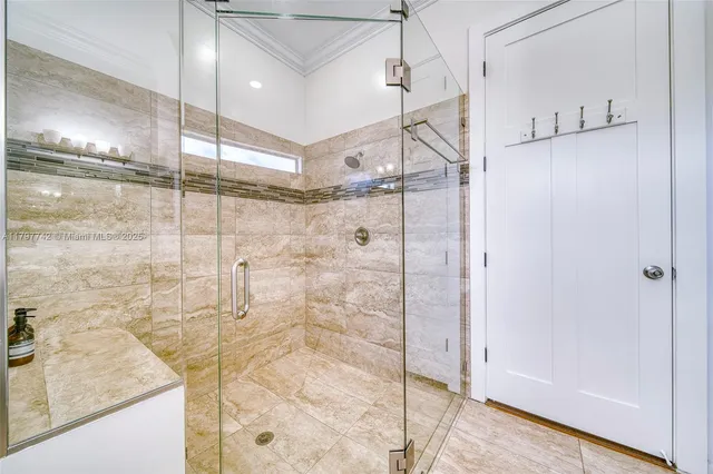 a bathroom with a shower and a mirror
