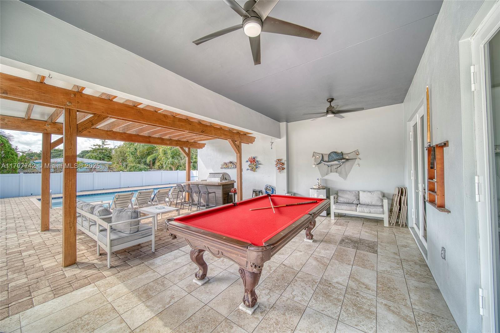 207 Southwest 11th Street Dania Beach, FL 33004 - Photo 34 of 37 a room with pool table and glass windows