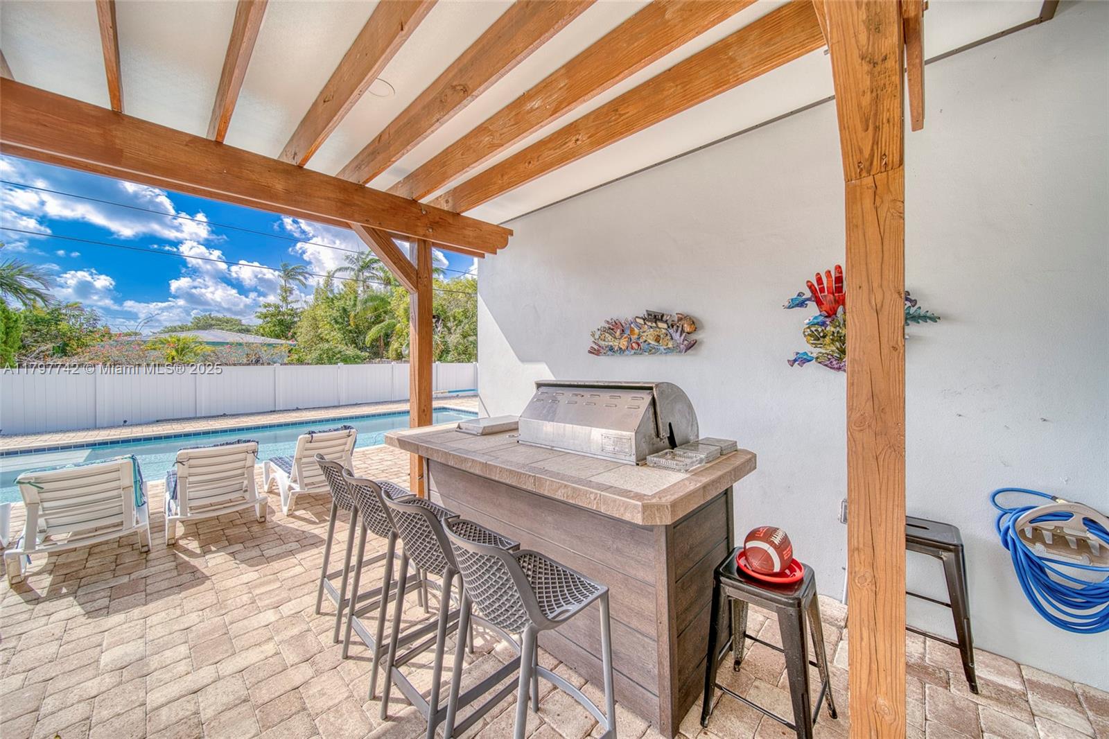 207 Southwest 11th Street Dania Beach, FL 33004 - Photo 35 of 37 a view of a dining room with furniture and wooden floor