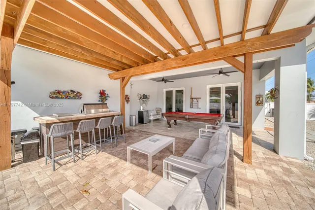 a view of a dining room with furniture and a rug