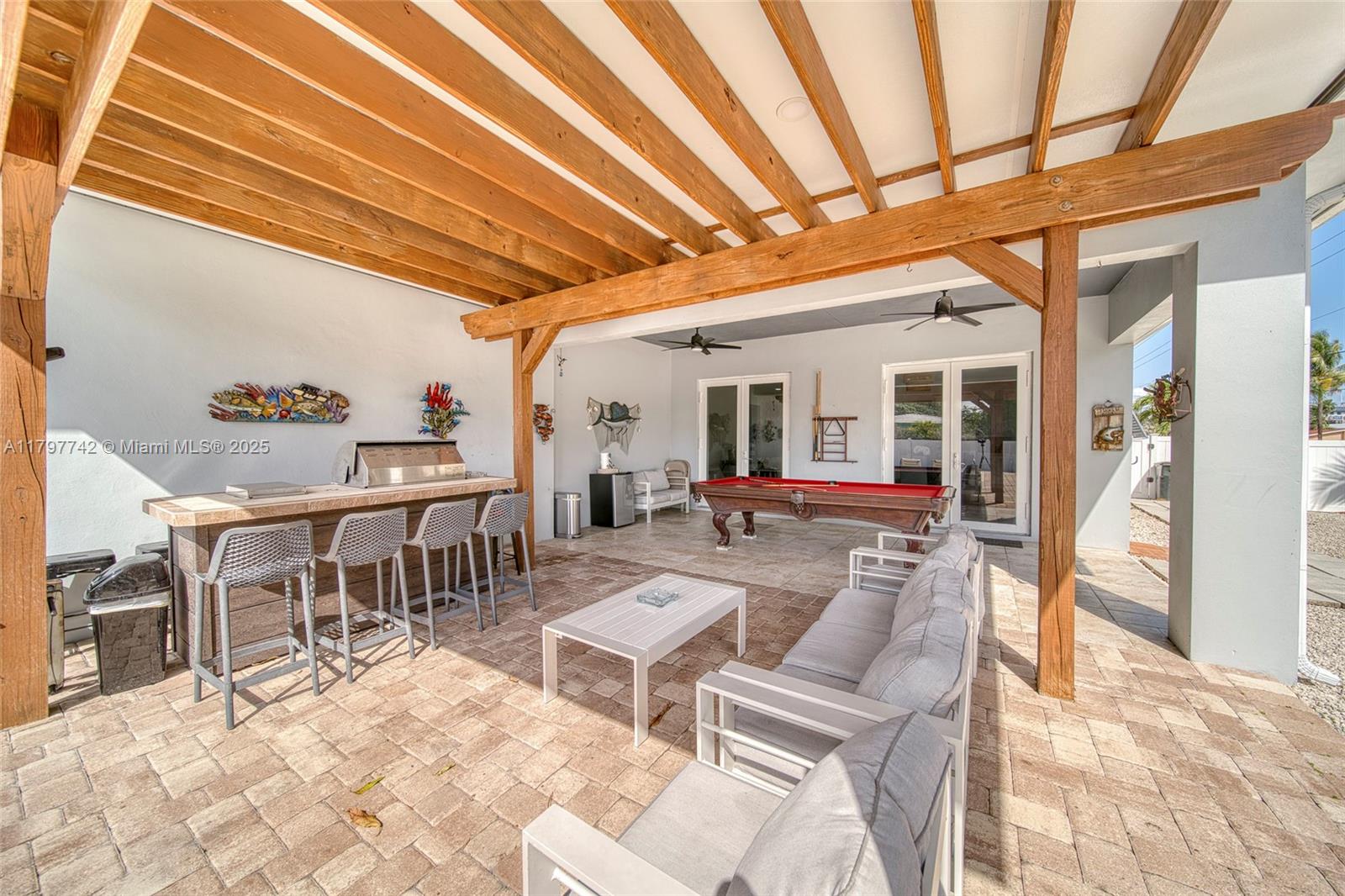 207 Southwest 11th Street Dania Beach, FL 33004 - Photo 36 of 37 a view of a dining room with furniture and a rug