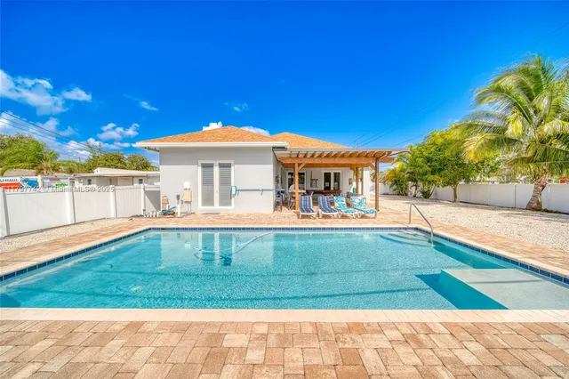 a view of a house with swimming pool