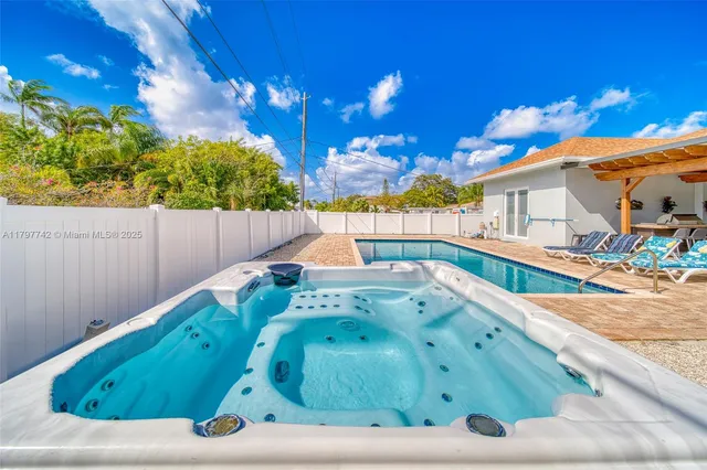a view of a backyard with a sitting area