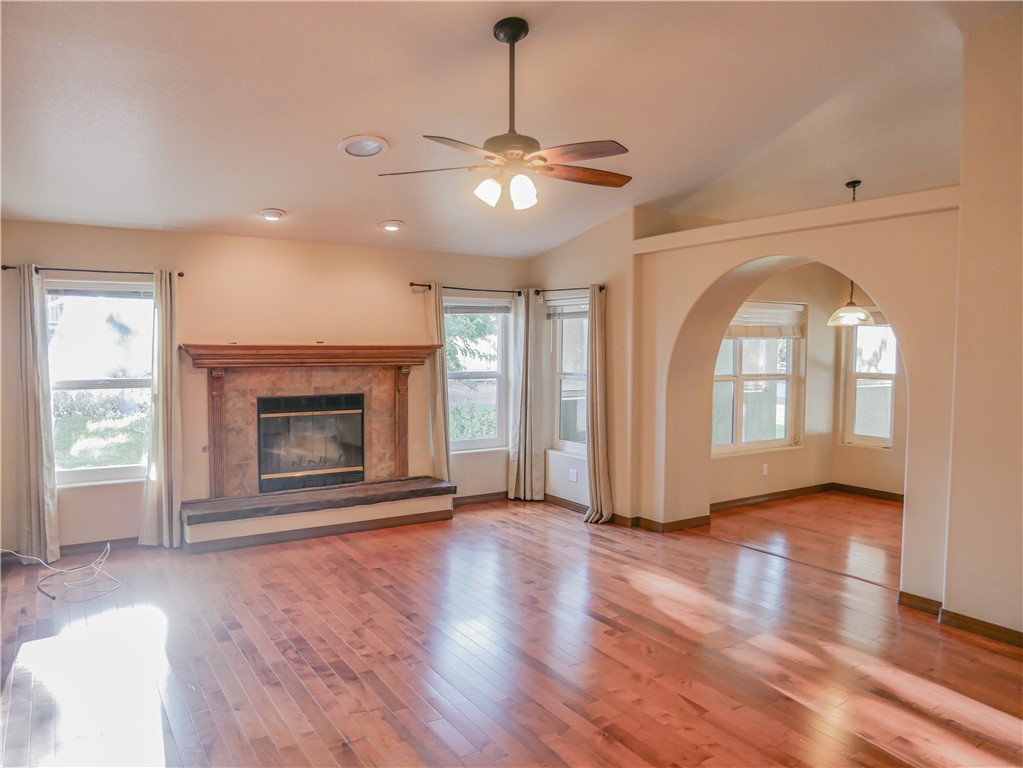 2575 Triangle S Street Kingman, AZ 86401 - Photo 32 of 45 a view of an empty room with wooden floor fireplace and a window