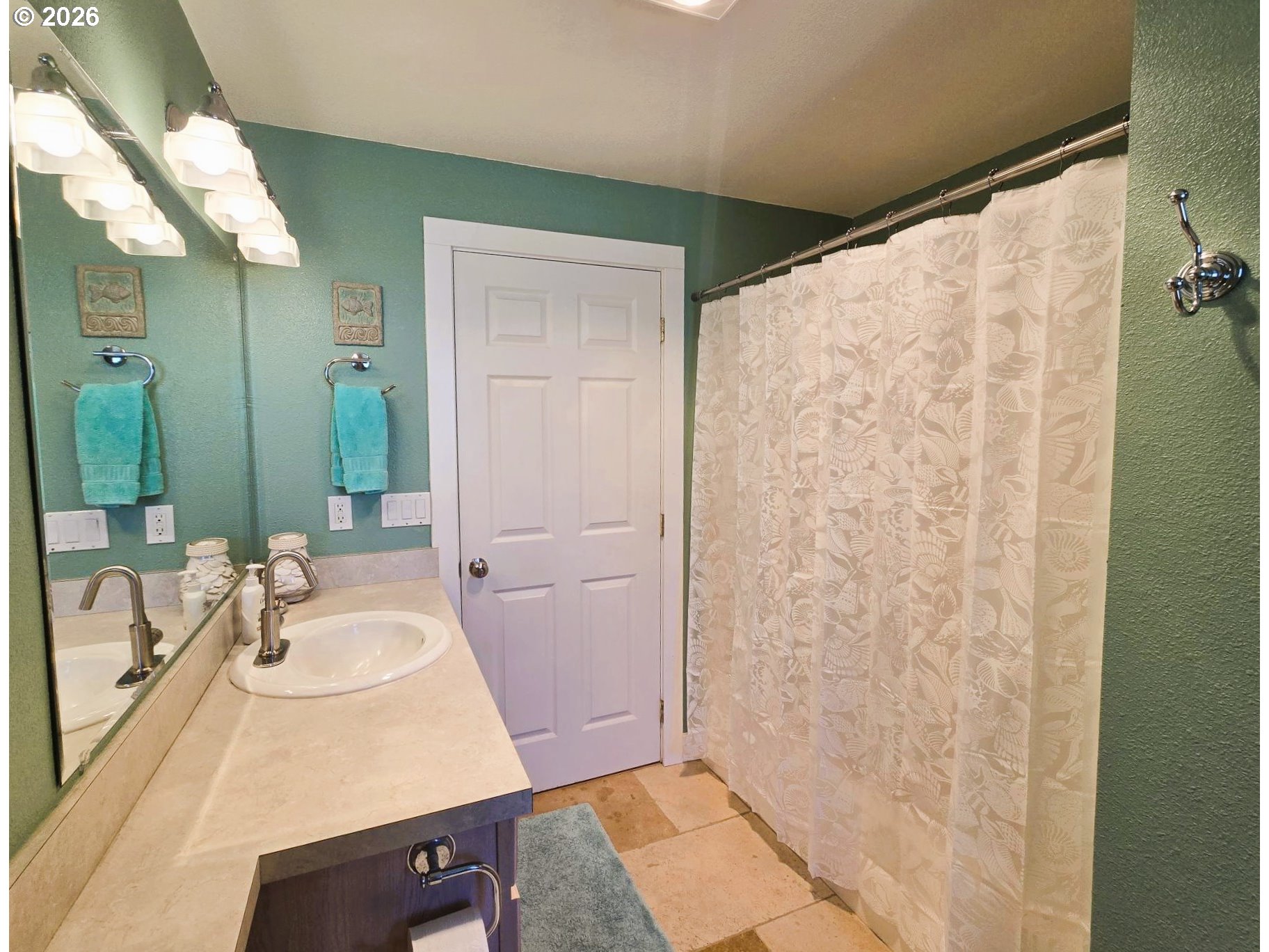 1265 34th Place Florence, OR 97439 - Photo 12 of 29 a bathroom with a sink and a mirror