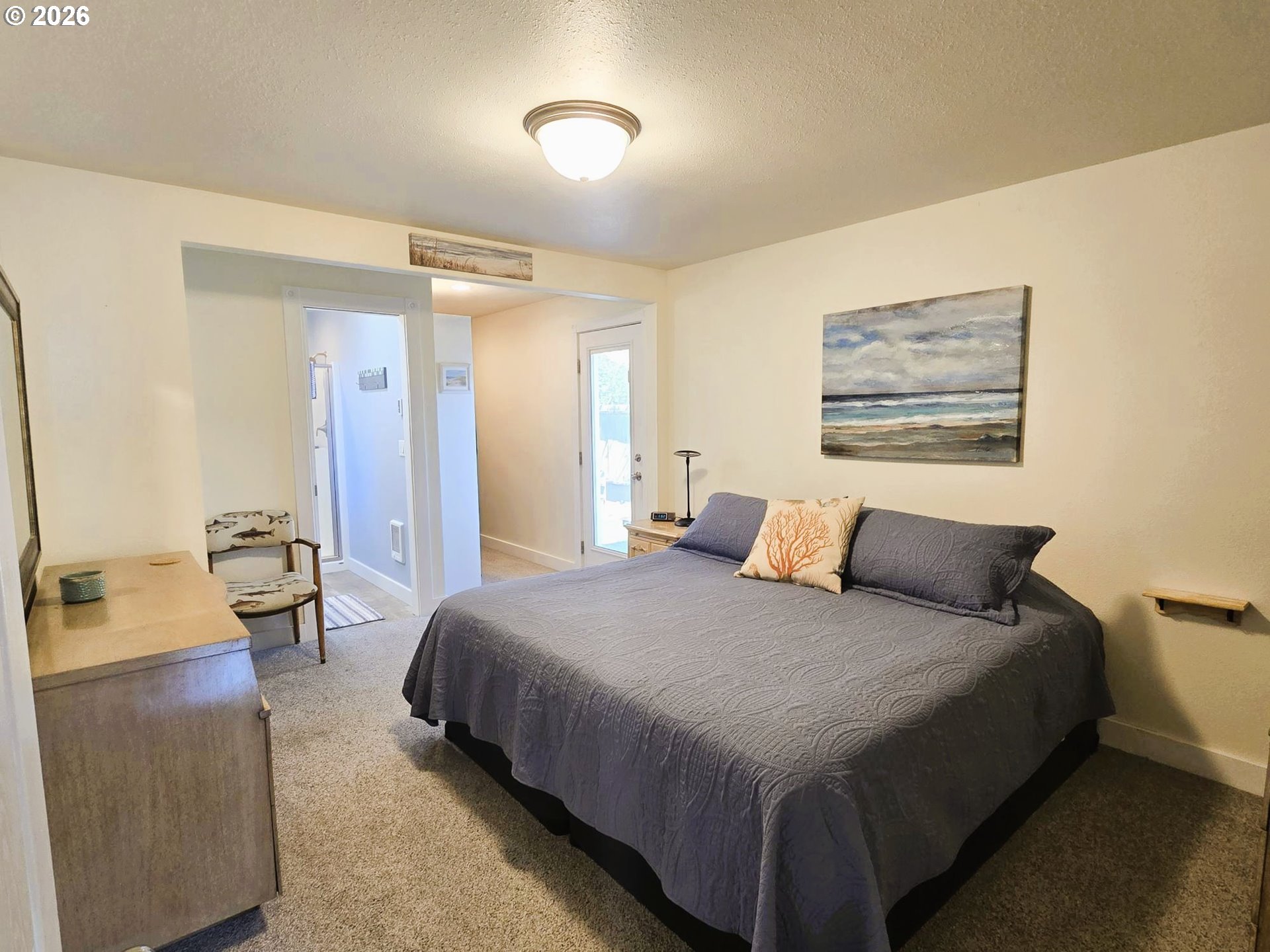 1265 34th Place Florence, OR 97439 - Photo 14 of 29 a bedroom with a bed and a couch