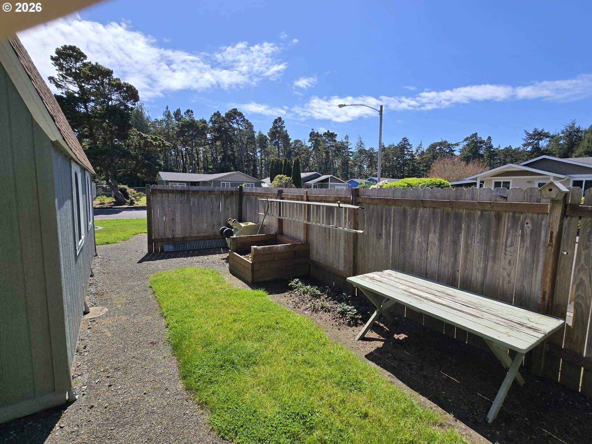 1265 34th Place Florence, OR 97439 - Photo 29 of 29 a view of a backyard with sitting area