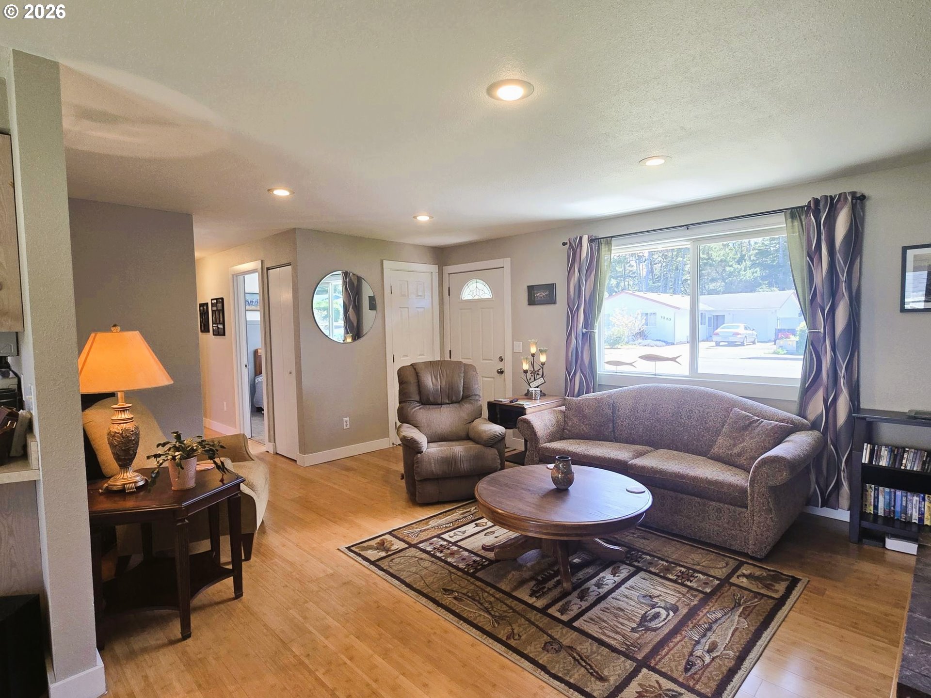 1265 34th Place Florence, OR 97439 - Photo 5 of 29 a living room with furniture and a window