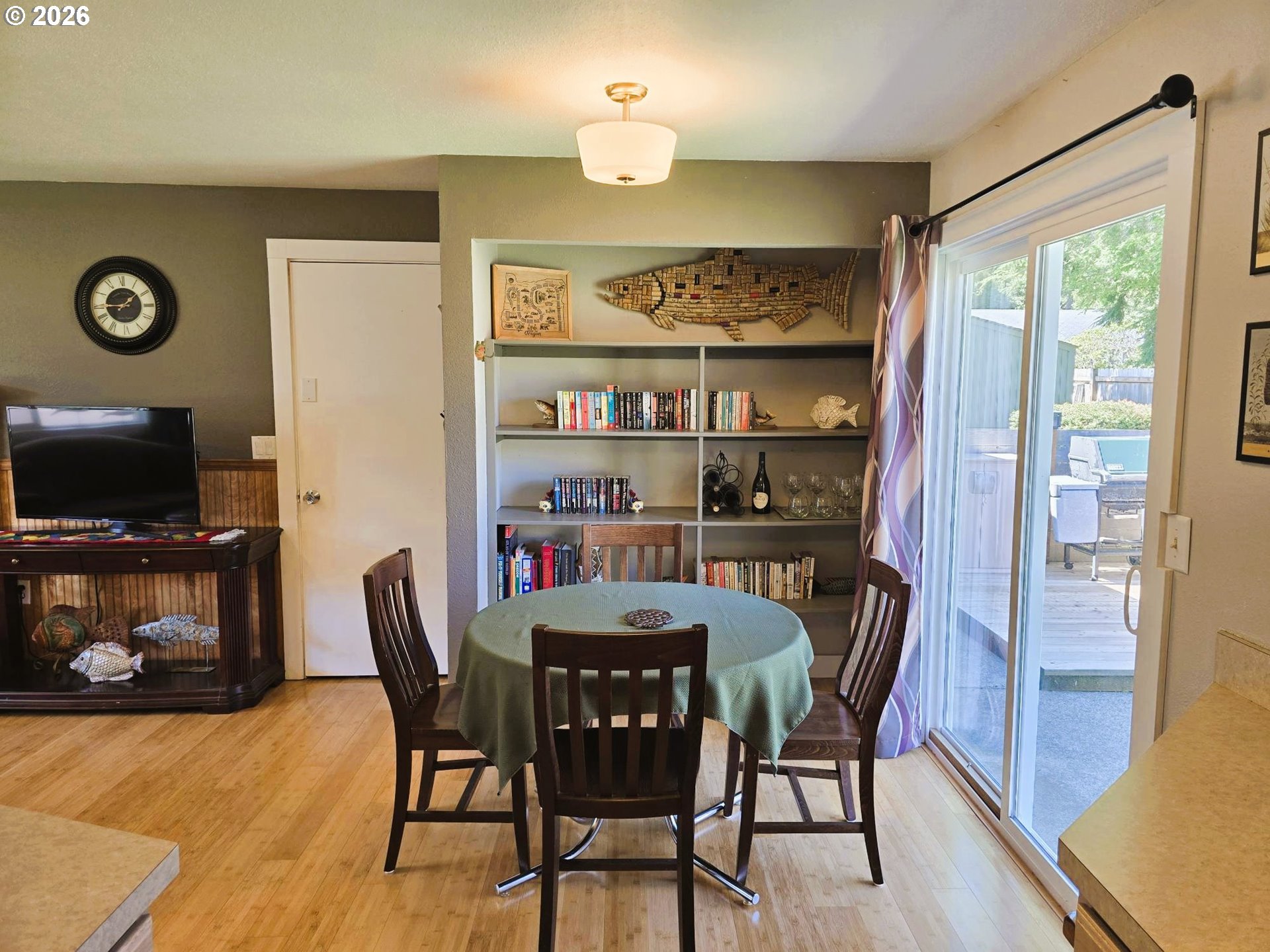 1265 34th Place Florence, OR 97439 - Photo 6 of 29 a view of a dining room with furniture window and wooden floor