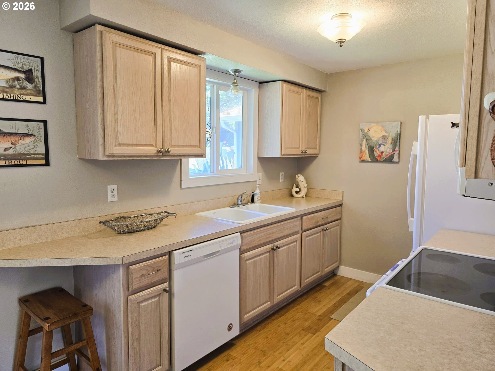 1265 34th Place Florence, OR 97439 - Photo 8 of 29 a kitchen with a sink and cabinets