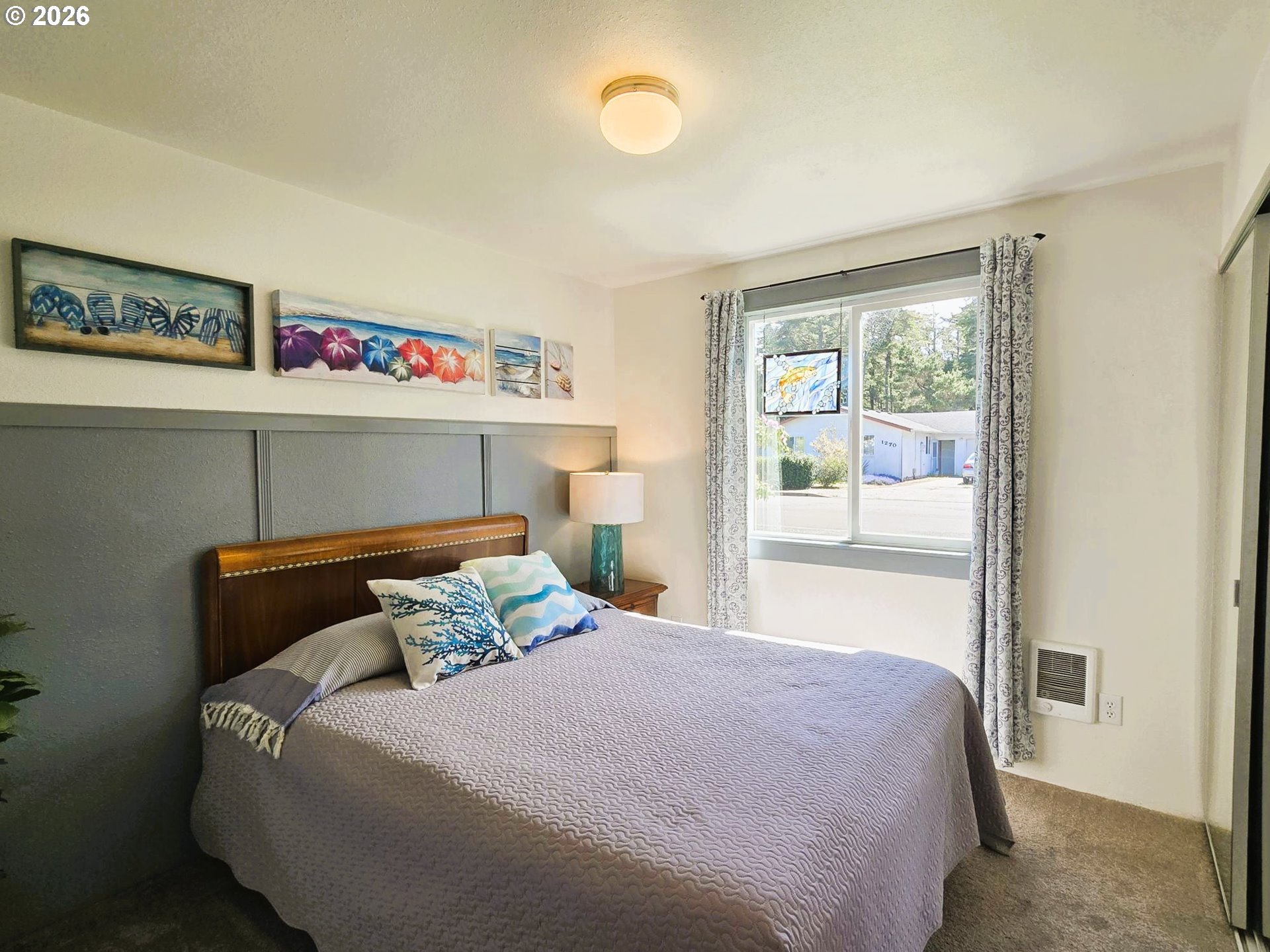 1265 34th Place Florence, OR 97439 - Photo 9 of 29 a bedroom with a bed and window