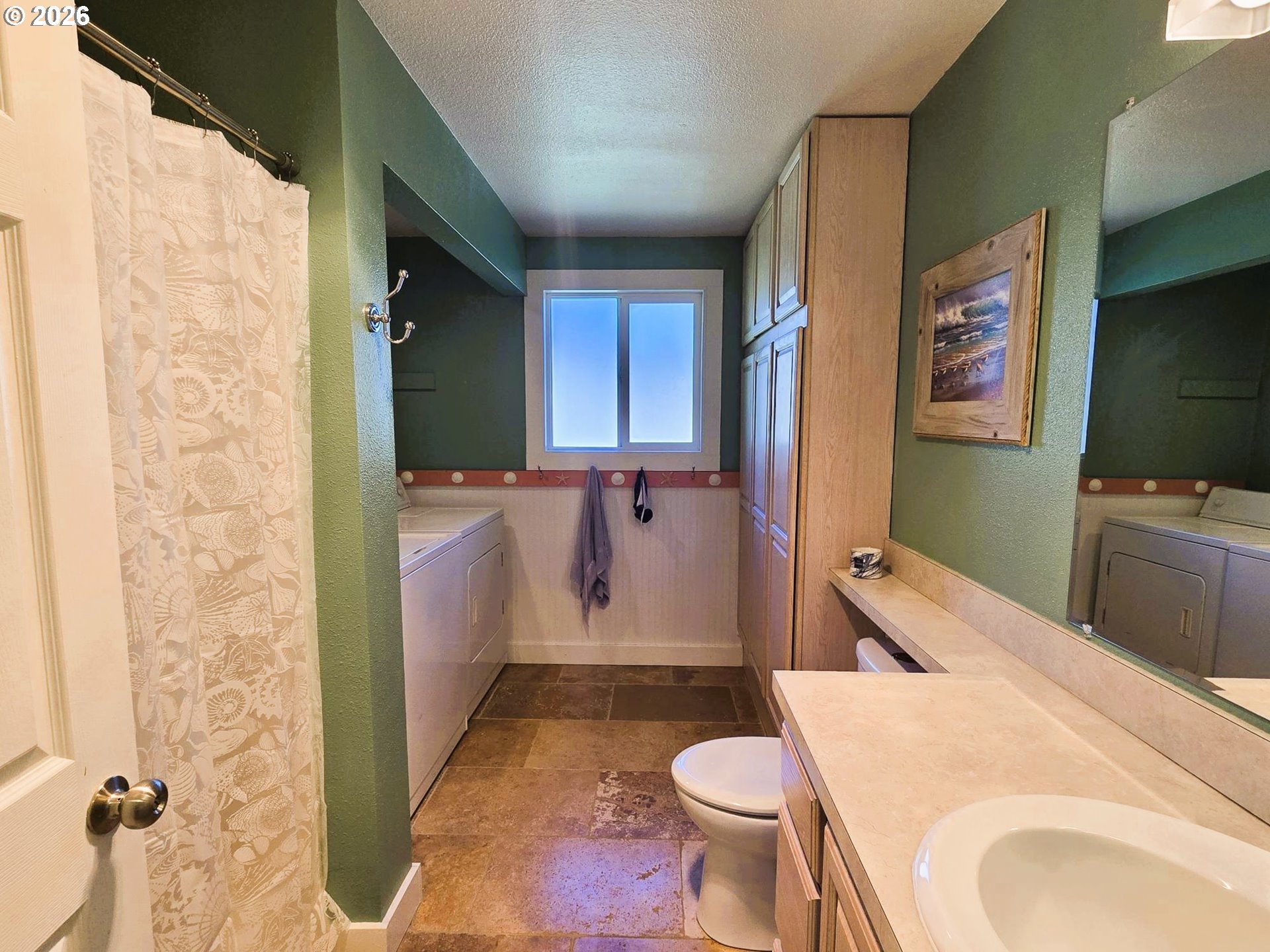 1265 34th Place Florence, OR 97439 - Photo 10 of 29 a bathroom with a sink toilet and shower