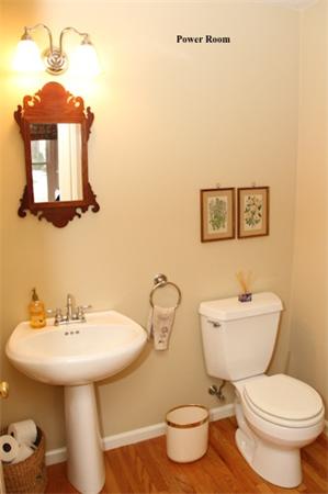 55 Edgewood Road Southborough, MA 01772 - Photo 11 of 18 a bathroom with a toilet a sink and mirror