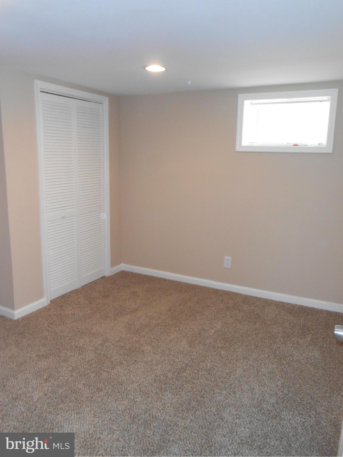3916 Weller Road Silver Spring, MD 20906 - Photo 12 of 19 a view of an empty room with a window