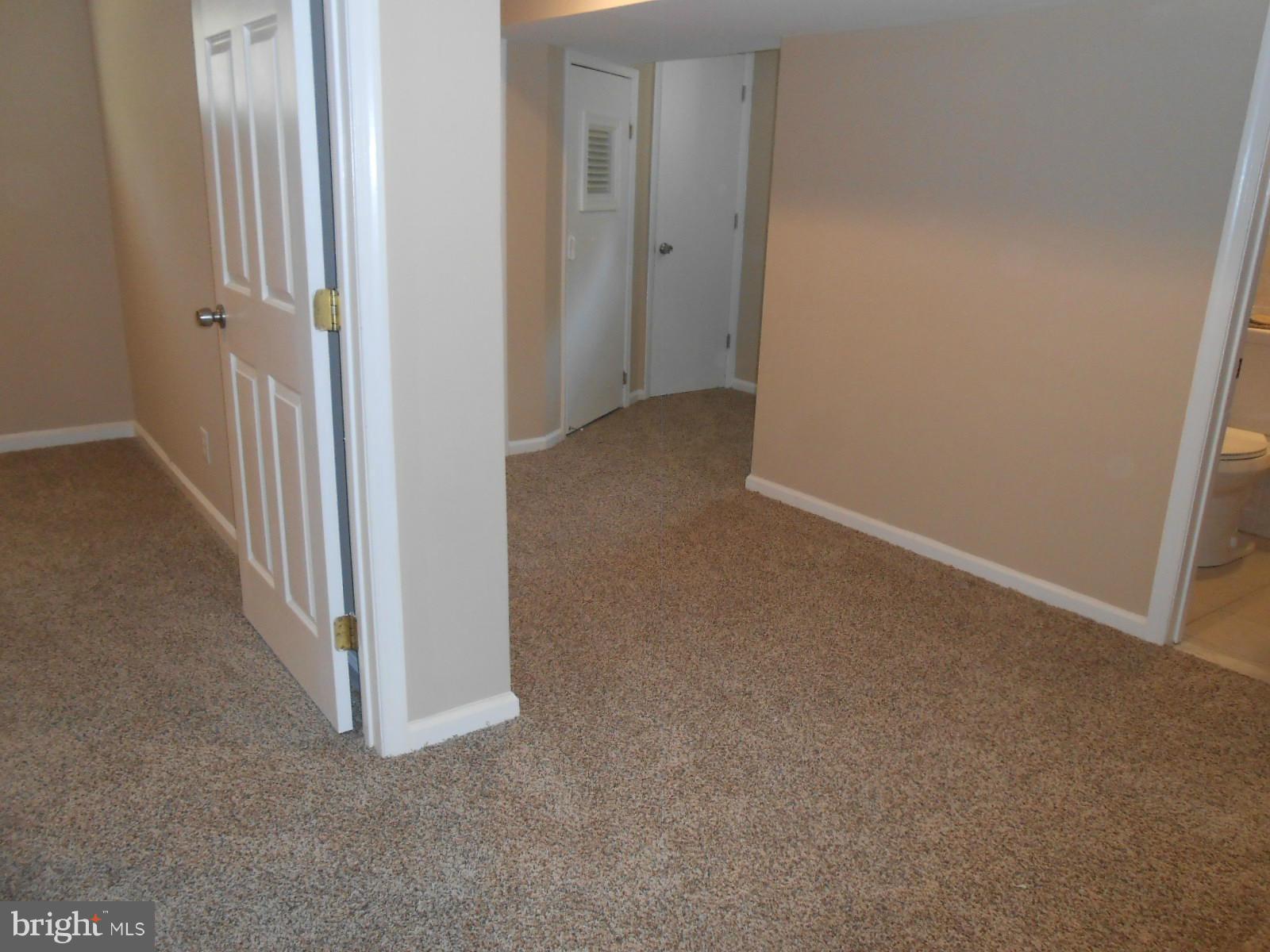 3916 Weller Road Silver Spring, MD 20906 - Photo 13 of 19 a view of a hallway with wooden floor