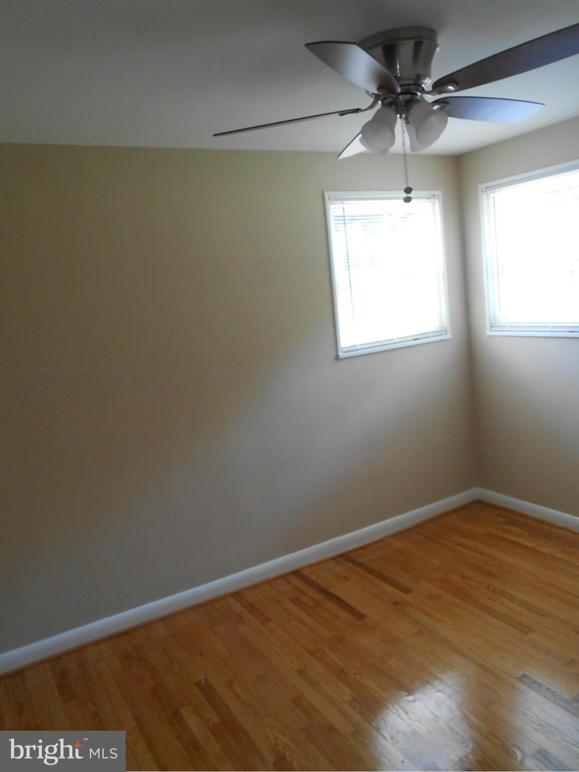 3916 Weller Road Silver Spring, MD 20906 - Photo 15 of 19 an empty room with a window and a fan