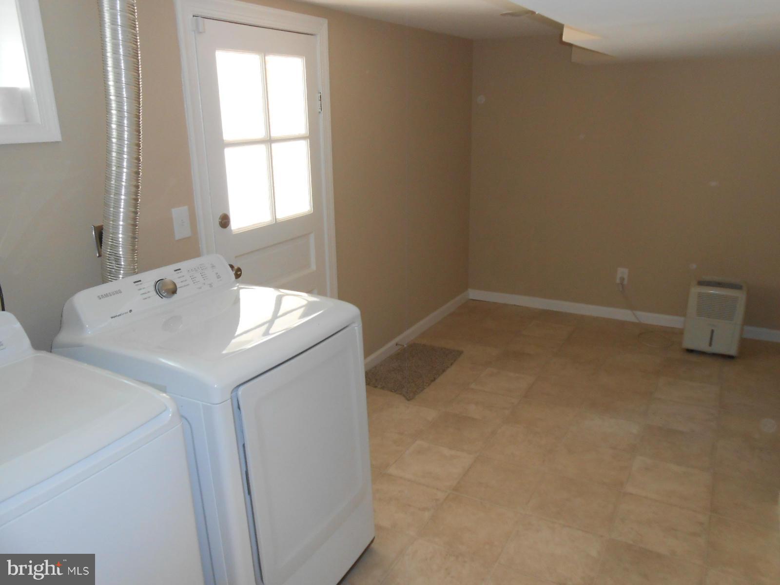 3916 Weller Road Silver Spring, MD 20906 - Photo 19 of 19 a utility room with dryer and washer