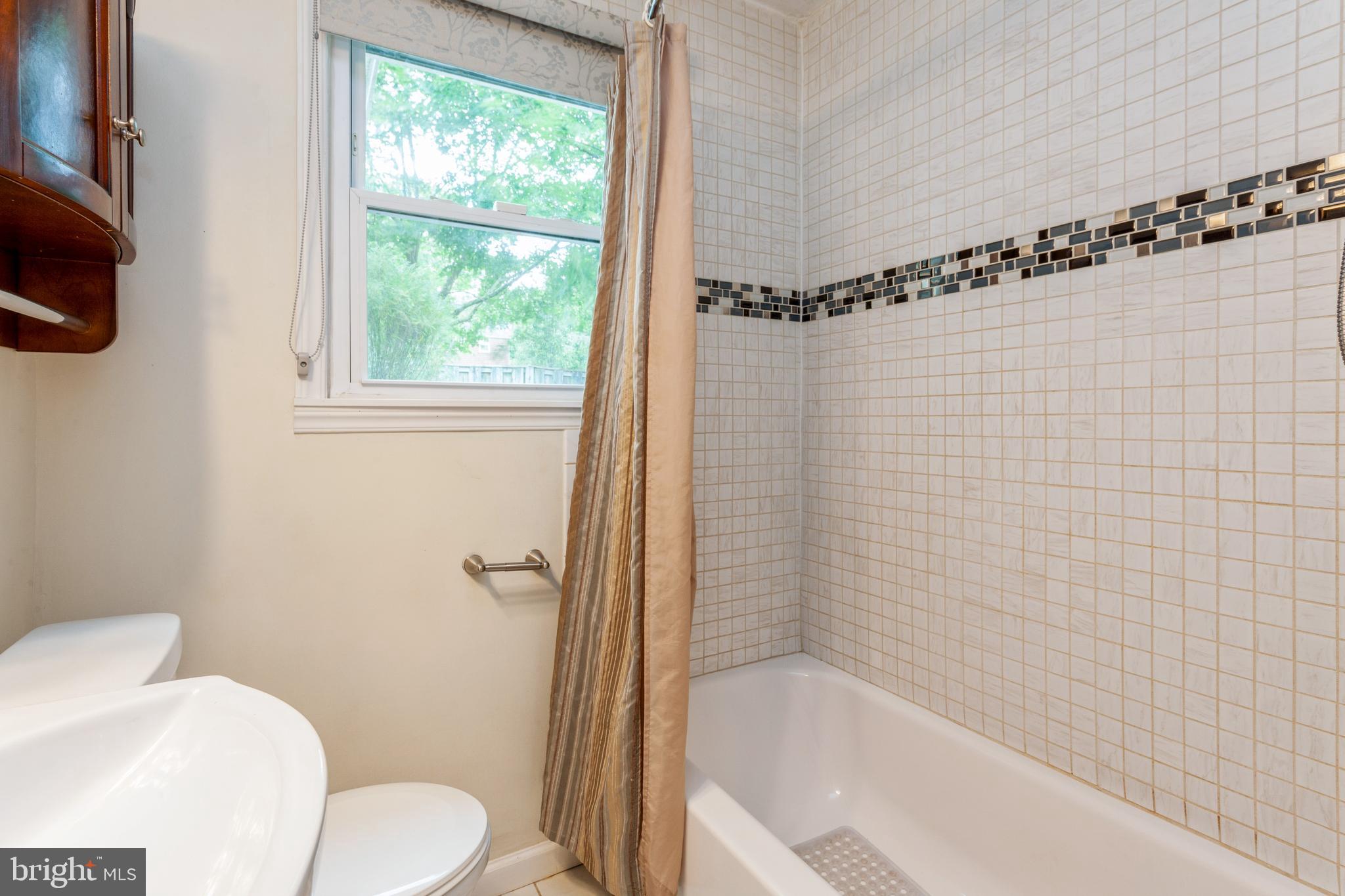 704 Greenwood Road Baltimore, MD 21208 - Photo 25 of 36 Hall Bath with mosaic design