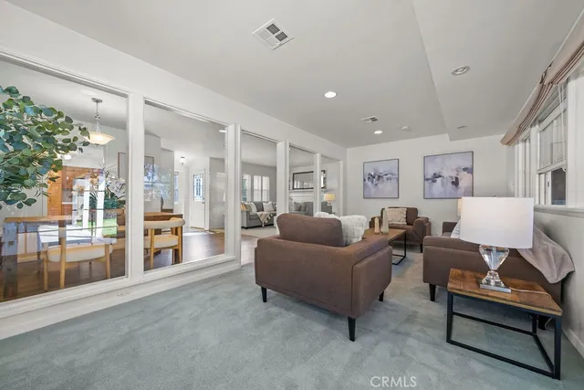 a living room with furniture and a table